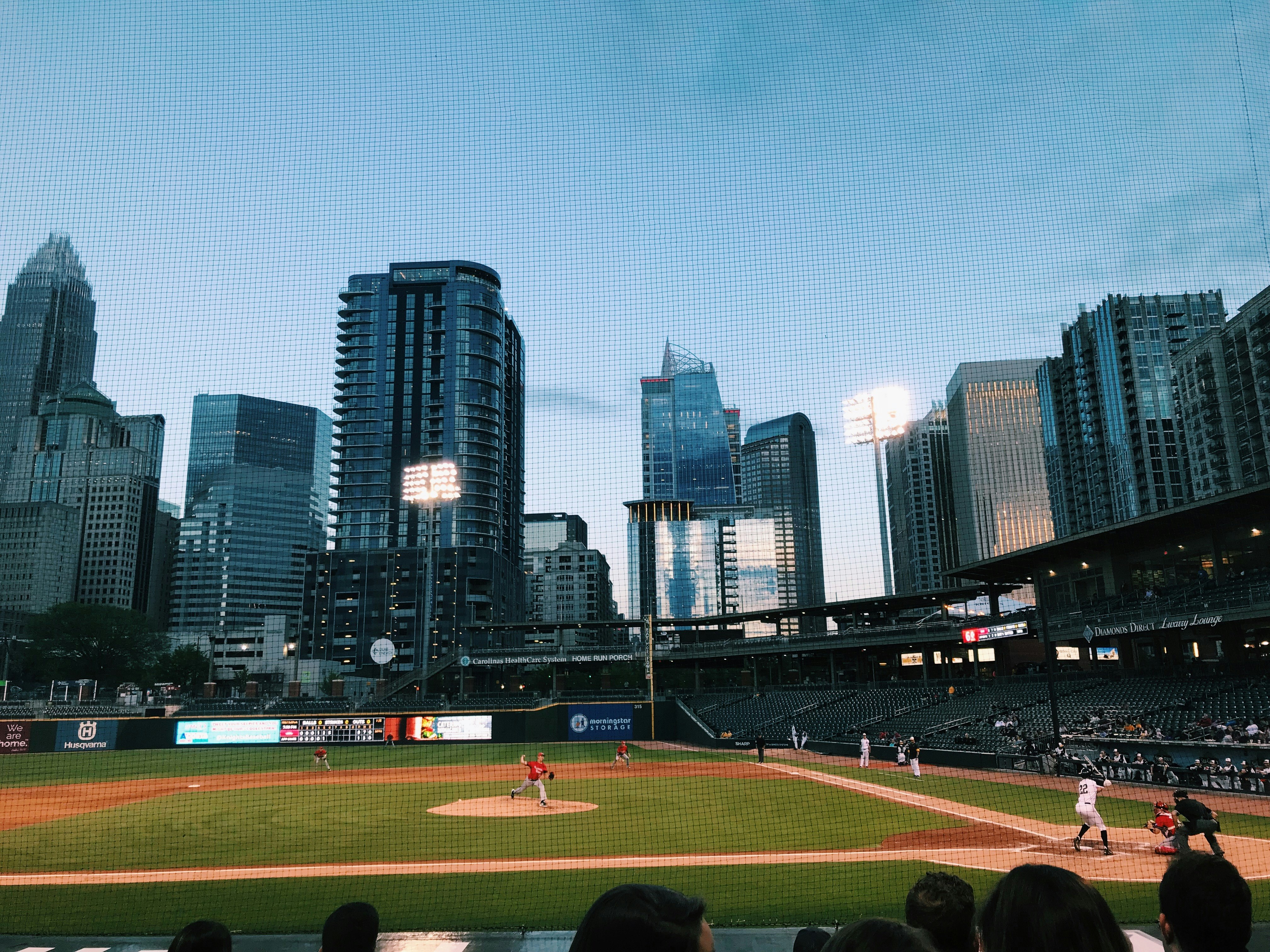 people watching baseball game during daytime